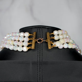 Elegant Ocean’s Majesty: Layered Shell & Faux Pearl necklace showcases a stunning multi-strand design perfect for any occasion.