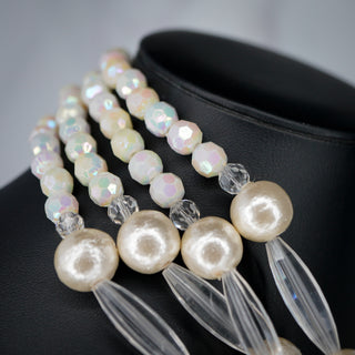 Elegant Ocean’s Majesty: Layered Shell & Faux Pearl necklace with shimmering beads, perfect for any occasion.