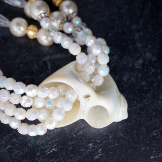 Elegant Ocean’s Majesty: Layered Shell necklace featuring faux pearls and iridescent beads, perfect for any occasion.