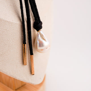 Stylish Black Cord Necklace with Large Baroque Pearl Pendant, featuring a unique 25x15mm pearl on a 64" suede cord.