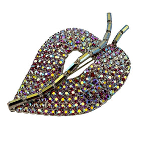 Multicolored rhinestone shoe laces on a neutral background