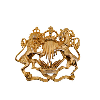 Gold emblem with lions and a crown on a gray background