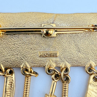 1988 JJ Goldtone Dangle Brooch and Earring Set with Figural Charms