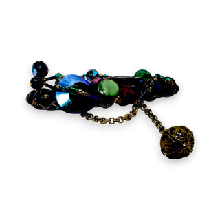 A vintage 1990 Sentimental Journey handmade brooch pin with multicolored beads, buttons, and a gold-tone chain.