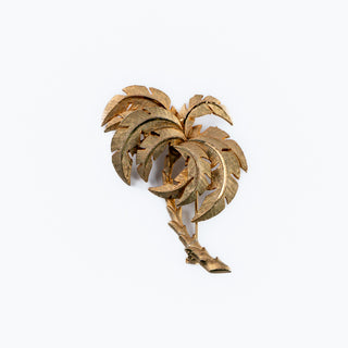 A vintage Spanish Damascene brooch with a silver and gold two-tone palm frond design.