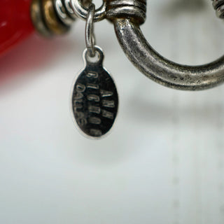 Reserved Grace Ann Cichon Dallas sterling silver maker tag hanging from a vintage artisan necklace