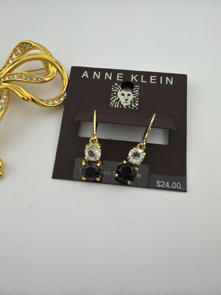 Reserved Grace Anne Klein jewelry set featuring a gold-tone crystal bow brooch and black and clear crystal drop earrings.