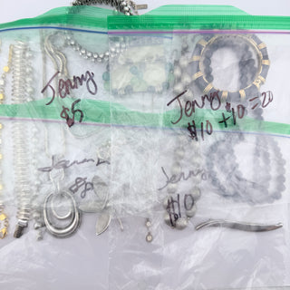 Reserved Grace assorted vintage-inspired costume jewelry collection including silver chains, beaded necklaces, and bangles.