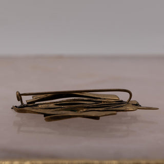 Reserved Grace vintage gold-tone brutalist brooch with an organic twig or coral-inspired design, side view.