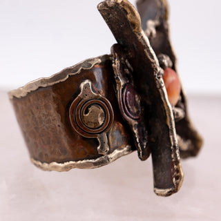 Reserved Grace handmade Brutalist cuff bracelet with textured metal frame and orange glass cabochon stone
