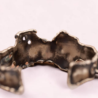 Reserved Grace artisan brutalist silver tone cuff bracelet with textured metal and dichroic glass accents