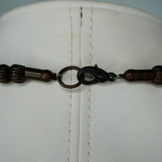 Reserved Grace vintage carnelian necklace featuring a secure dark metal lobster clasp closure on a white display bust.