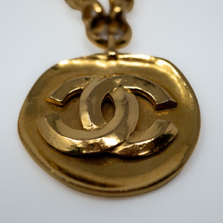 Reserved Grace vintage Chanel gold-plated necklace featuring a round medallion with an interlocking CC logo