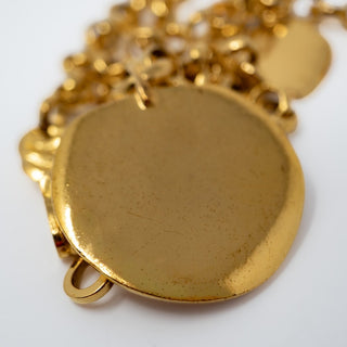 Reserved Grace vintage Chanel gold-plated belcher chain necklace with a round medallion pendant on a white background.