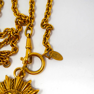 Reserved Grace vintage Chanel gold-plated sunburst necklace featuring a heavy link chain and signature logo charm