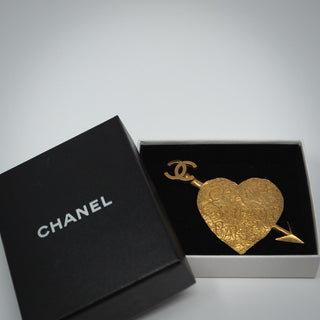 Reserved Grace vintage Chanel 1993 gold-plated heart and arrow brooch with Rue Cambon Paris graffiti in a gift box.