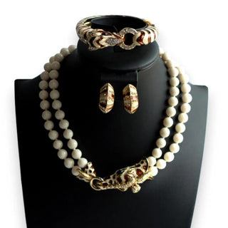 Reserved Grace vintage Ciner wildlife parure featuring a giraffe necklace, zebra bracelet, and matching enamel earrings.