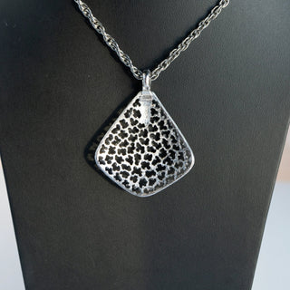 Reserved Grace vintage Crown Trifari silver tone pendant necklace featuring a mod leopard spot cutout design