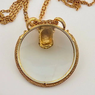Reserved Grace vintage Florenza goldtone magnifying glass pendant necklace featuring a detailed ram head design.