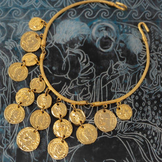 Reserved Grace gold-tone choker bib necklace featuring cascading ancient Greek coin charms on a rigid textured collar.