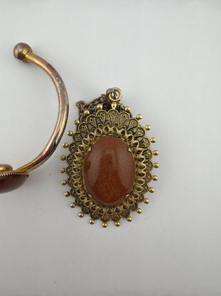 Reserved Grace vintage-inspired goldstone cuff bracelet and filigree pendant necklace set in antique gold tone.