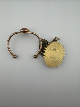 Reserved Grace vintage-inspired cuff bracelet and pendant necklace set with shimmering goldstone and antique-gold finish.