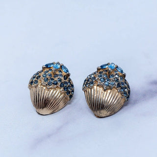Reserved Grace vintage Jomaz gold-tone clip-on earrings featuring architectural shell designs with blue rhinestones.