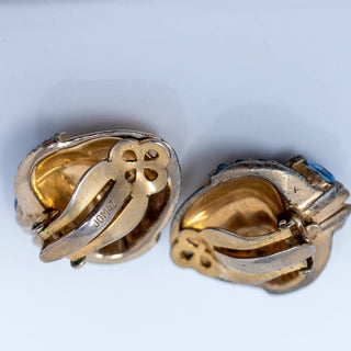 Reserved Grace vintage Jomaz gold-tone clip-on earrings featuring blue rhinestones and signed metal backings