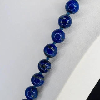 Reserved Grace deep blue lapis lazuli beaded necklace with a symbolic design, 36 inches long.