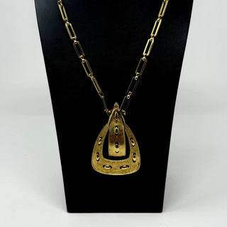 Reserved Grace vintage 1970s Monet gold-tone link necklace featuring an elegant belt buckle pendant on a display bust.
