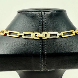 Reserved Grace vintage 1970s Monet gold-tone link necklace featuring a textured rectangular clasp detail on a display.
