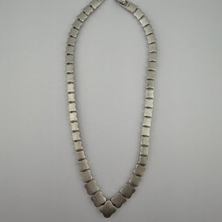 Reserved Grace vintage Monet silver-tone articulated link necklace with scalloped clover-inspired segments.