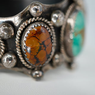 Reserved Grace vintage Navajo sterling silver cuff bracelet featuring a central ammonite fossil and Royston turquoise