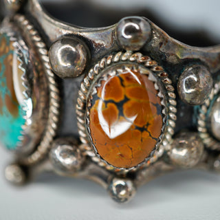 Reserved Grace vintage Navajo sterling silver cuff with a central ammonite fossil and Royston turquoise cabochons.