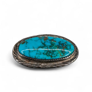 Reserved Grace vintage Navajo sterling silver pin featuring a large oval turquoise cabochon with dark matrix patterns.