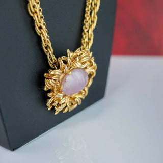 Reserved Grace vintage Oscar de la Renta gold-tone necklace featuring a pink cabochon flower pendant on a chain.