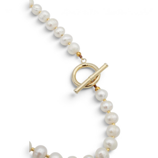 Reserved Grace vintage Fran Ridell pearl necklace featuring lustrous white pearls and a gold-tone toggle clasp.