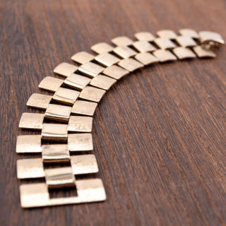 Reserved Grace vintage Sarah Coventry gold tone chain link bracelet with a secure fold over clasp on wood surface