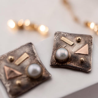 Reserved Grace abstract square earrings in sterling silver with 9ct gold accents and a bezel-set natural pearl.