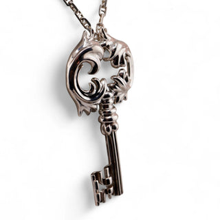Reserved Grace vintage sterling silver Rococo key pendant featuring intricate scrollwork on a long Italian 925 chain.