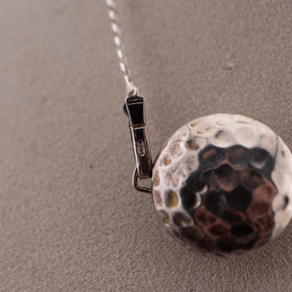 Reserved Grace sterling silver Saturn chain necklace featuring a hammered metal bead charm with a 925 hallmark.