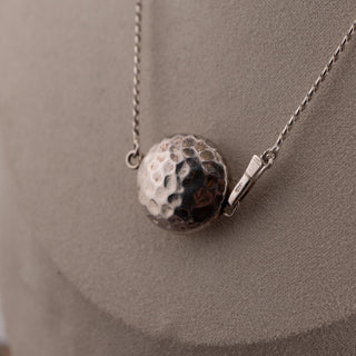 Reserved Grace sterling silver Saturn chain necklace with a textured hammered sphere pendant on a 16-inch chain.