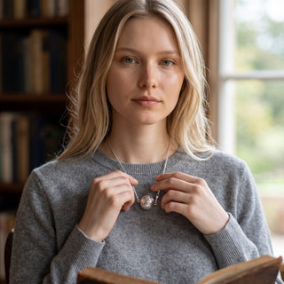Reserved Grace sterling silver Saturn chain necklace worn by a woman in a grey sweater, 16-inch minimalist jewelry