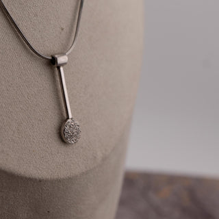 Reserved Grace sterling silver spoon pendant on a 17-inch chain with a textured circular detail