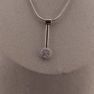 Reserved Grace sterling silver spoon pendant on a 17-inch snake chain, featuring a textured circular end.