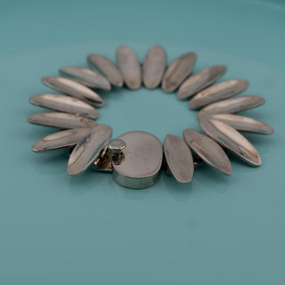 Reserved Grace vintage Taxco Mexican Modernist sterling silver sunburst link bracelet with polished convex oval links.