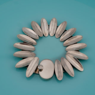 Reserved Grace vintage Taxco Mexican Modernist sterling silver sunburst link bracelet with polished oval links.