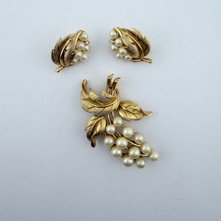 Reserved Grace vintage Trifari brooch and clip-on earring set with gold-tone textured leaves and cream faux pearls.