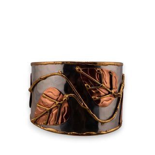 Reserved Grace Anju tri-tone cuff bracelet featuring silver, copper, and brass leaf appliqués on a wide metal band.