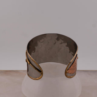 Reserved Grace Anju tri-tone cuff bracelet featuring hammered silver, copper, and brass leaf appliqués.